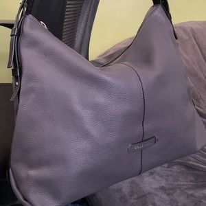 A large simple hobo with a short strap in pebble leather. Super lightweight.